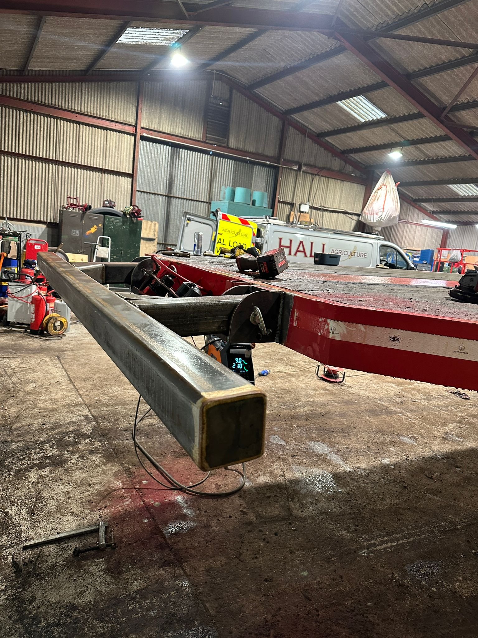 Agriwelding custom agricultural welding and fabrication work on heavy-duty farm equipment in a workshop